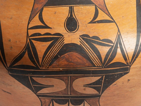 Close up view of polychrome designs on a large Hopi pot.