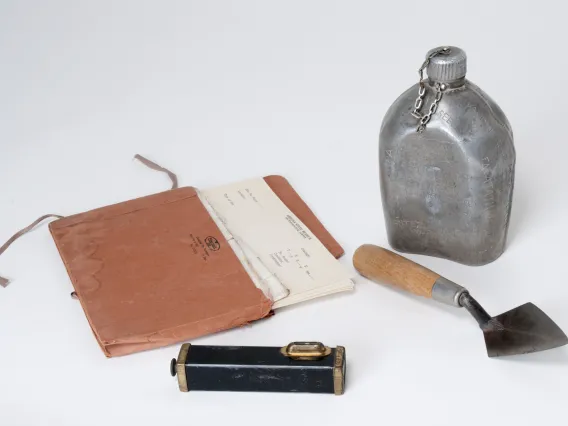 Metal canteen with the names and dates of his expeditions scratched into the surface