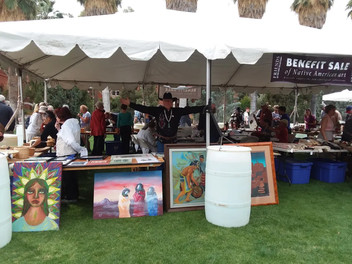 An annual benefit sale of donated Native American art is the signature fundraising event produced by the Friends of the ASM Collections. Above, volunteer Ray St. Clair welcomes one and all.