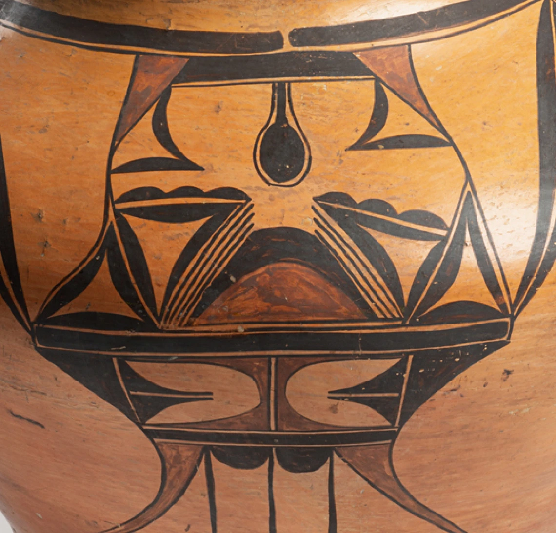 Close up view of polychrome designs on a large Hopi pot.