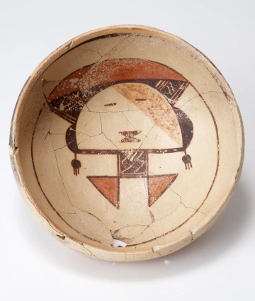 A polychrome bowl showing a katsina face.