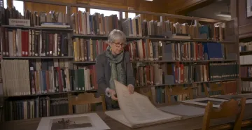 Adult in the library working at a table